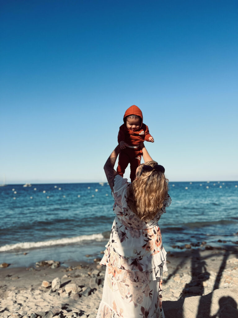 evelyn with her toddler at the beach