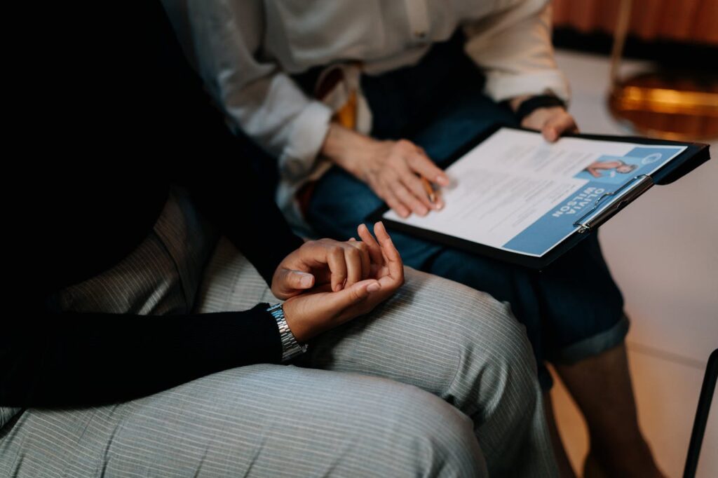 2 people looking over a resume that is professionally written 